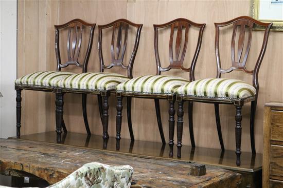 An Edwardian seven piece inlaid and ebonised salon suite settee W.135cm